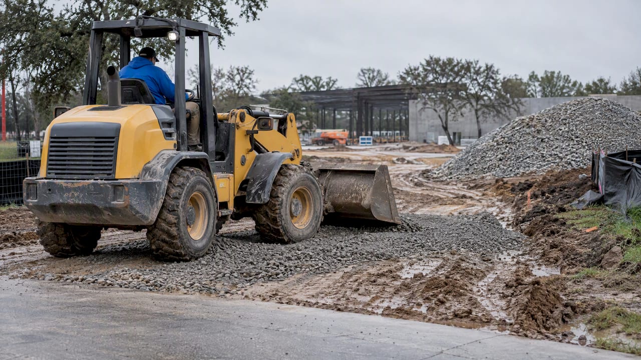 Coarse gravel covering a muddy site entrance